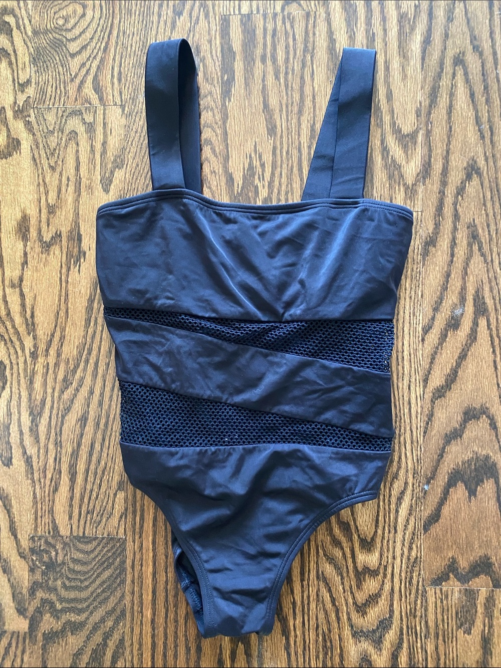 Woman’s Black One-Piece Swimsuit with Diagonal Mesh Insets